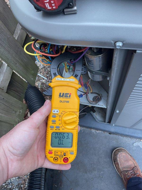Performed annual cooling maintenance on residential air conditioning system. Conducted electrical diagnostics using digital multimeter to verify proper voltage and amperage readings across capacitor and control circuits. Inspected and tested dual run capacitor, confirmed all electrical connections secure with proper wire routing. All components operating within manufacturer specifications, system ready for cooling season.