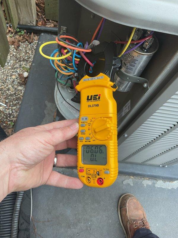 Performed annual cooling maintenance on residential air conditioning system. Conducted electrical diagnostics using digital multimeter to verify proper voltage and amperage readings across capacitor and control circuits. Inspected and tested dual run capacitor, confirmed all electrical connections secure with proper wire routing. All components operating within manufacturer specifications, system ready for cooling season.