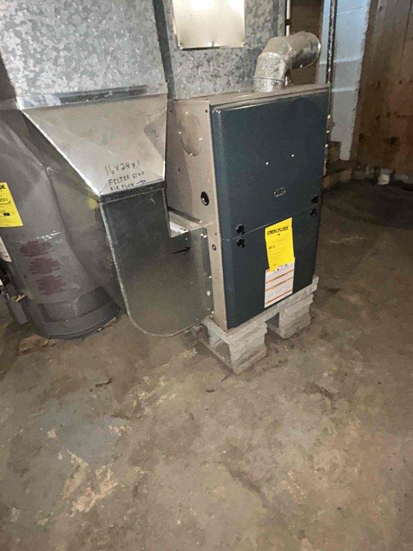 Conducted on-site evaluation for new air conditioning system installation at residential property with no existing AC unit. Assessed basement mechanical room containing existing furnace and ductwork infrastructure to determine optimal placement and integration requirements for new cooling system. Documented existing HVAC setup, ductwork configuration, and available space for equipment installation through photographic records to support equipment sizing and installation planning.