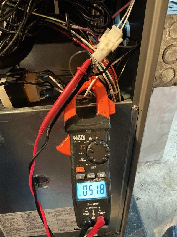 Completed comprehensive ComfortGuard maintenance package on HVAC system. Performed electrical diagnostic testing using clamp meter, measuring amperage readings of 5.56A and 5.18A on system wiring and connections to verify proper electrical draw and component operation. All electrical connections inspected and confirmed secure with proper voltage and current flow within manufacturer specifications.