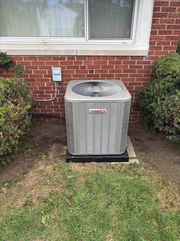 Completed installation of 2.5-ton Lennox air conditioning system with matching evaporator coil at residential property. Positioned outdoor condensing unit on equipment pad at rear of home with proper clearances, installed indoor coil with furnace/air handler in basement mechanical room, and reconnected all electrical and refrigerant lines. All mechanical and electrical permits were obtained prior to installation, system was tested and verified operational upon completion.
