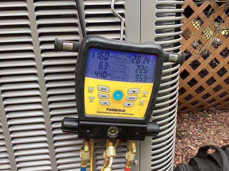 Responded to no-cool call on newly installed 0-year-old air conditioning system that would not power on. Upon arrival, discovered disconnect switch at outdoor unit was in the off position, with warning label still attached from recent installation. Restored power by engaging disconnect switch and verified proper system operation. Connected refrigerant manifold gauges to outdoor unit and confirmed pressures within normal operating range, with readings showing 116.0 PSI on high side and appropriate subcooling values. Checked voltage at indoor air handler, measuring 5.5 volts DC at control board to verify proper transformer output and thermostat communication. Performed complete system checkout including blower operation, refrigerant charge verification, and thermostat functionality. System cooling properly with no mechanical or electrical deficiencies identified. Educated customer on disconnect switch location and proper operation for future reference.
