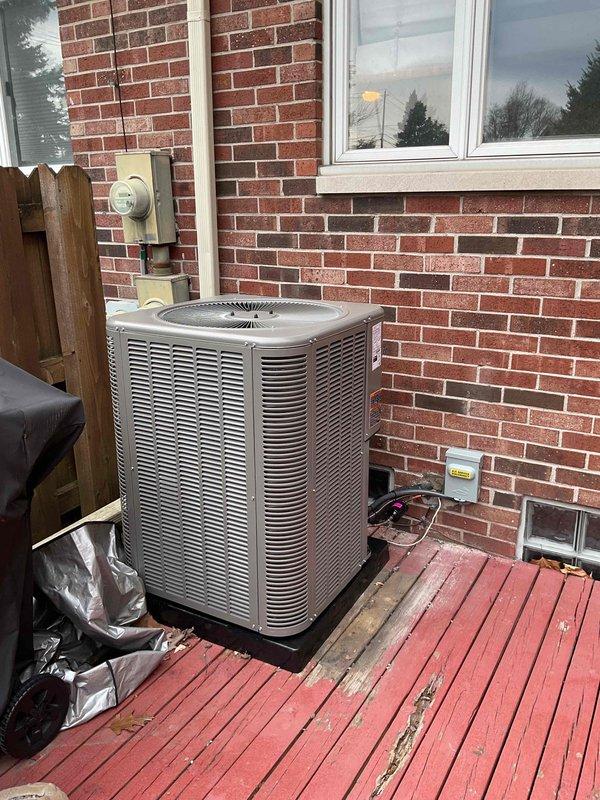 Completed installation of 2-ton air conditioning system with matching evaporator coil. Installed outdoor condenser unit on deck-mounted pad with proper electrical disconnect and reconnected to existing furnace system in basement. System positioned in rear location with refrigerant lines run between indoor and outdoor components. Verified all electrical connections, tested system operation, and ensured proper airflow through new coil integrated with existing ductwork. Installation completed per mechanical permit specifications with all components functioning within manufacturer specifications.
