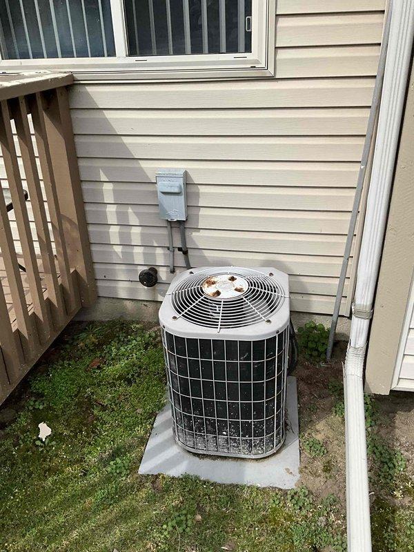 Provided comprehensive replacement estimate for 30-year-old residential HVAC system consisting of Carrier furnace and air conditioning unit located in basement with outdoor condenser. Both units remain operational but have reached end of expected service life, showing significant wear, weathering, and debris accumulation. Assessed existing installation configuration including ductwork connections, electrical disconnect, concrete pad condition, and venting system to determine optimal replacement specifications and equipment sizing requirements.