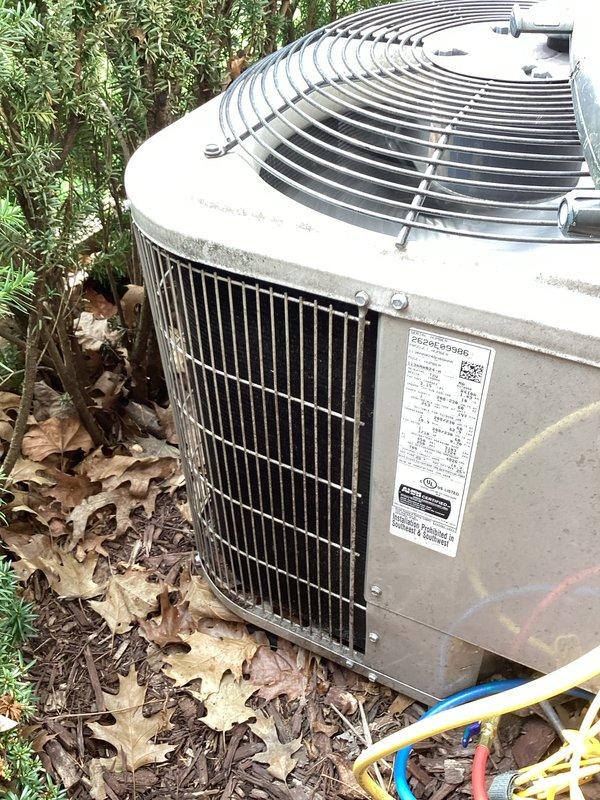 Completed annual preventative maintenance on residential outdoor condensing unit. Performed comprehensive system inspection, verified proper operation of all components including fan motor and compressor, checked refrigerant lines for integrity, and documented unit condition with photos showing equipment in functional state with minor outdoor weathering consistent with normal exposure.
