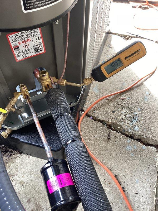 Successfully completed installation of a 2.5-ton Lennox air conditioning system with matching evaporator coil at rear discharge location. All mechanical, electrical, and refrigerant connections were properly executed, system was charged to manufacturer specifications, and final testing confirmed proper operation with diagnostic equipment readings within normal parameters.