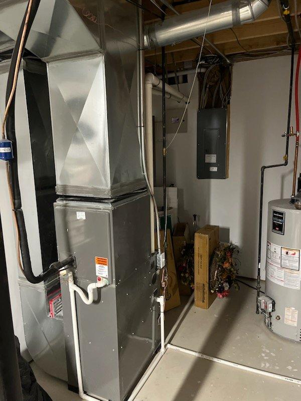 Completed annual cooling maintenance on residential HVAC system, inspecting air handler unit, ductwork, electrical connections, and condensate drainage lines. All components operating within normal parameters with no filter replacement required at this time.