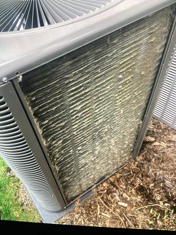 Completed scheduled ACM maintenance on outdoor condensing unit. Condenser coils exhibited heavy accumulation of dirt, dust, pollen, and debris significantly restricting airflow through the fins. Cleaned and serviced unit, replaced air filter and evaporative cooler pad as scheduled.
