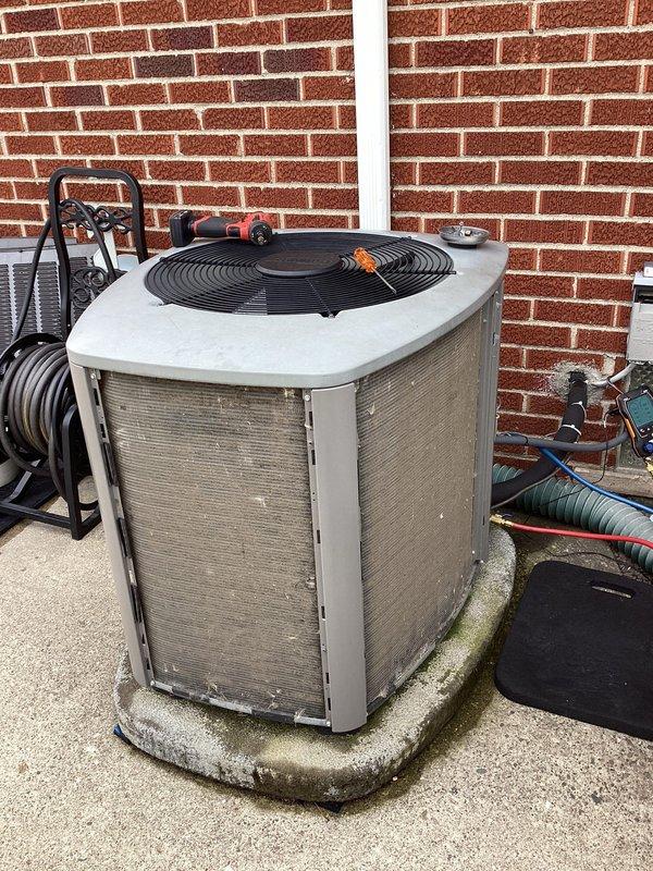 Completed routine maintenance on Lennox outdoor air conditioning condenser unit. Performed standard ACM procedures including inspection of unit components, cleaning of condenser coils, verification of proper operation, and assessment of concrete pad condition which showed weathering and algae growth along edges. Unit found to be in functional condition with all components operating within normal parameters.