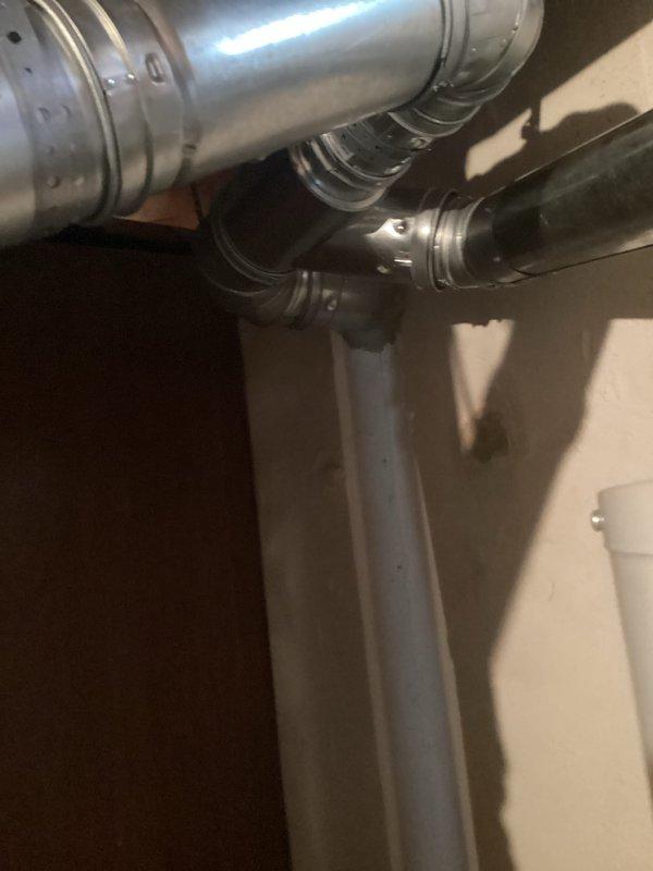 Completed installation of 40-gallon tanked water heater in residential mechanical room. Removed existing unit and installed new water heater with proper venting connections, gas line hookup, and water supply line reconnection. Obtained mechanical permit for hot water heater installation and reconnection, ensuring all work met code requirements and manufacturer specifications.