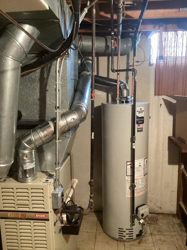 Completed installation of 40-gallon tanked water heater in residential mechanical room. Removed existing unit and installed new water heater with proper venting connections, gas line hookup, and water supply line reconnection. Obtained mechanical permit for hot water heater installation and reconnection, ensuring all work met code requirements and manufacturer specifications.