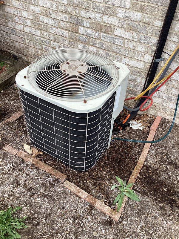 Completed annual preventive maintenance on residential split system air conditioning unit. Performed comprehensive inspection of outdoor condensing unit including coil condition assessment, electrical connections, refrigerant line integrity, and fan operation verification. Unit found in operational condition with normal outdoor weathering, all safety components intact and functioning properly.