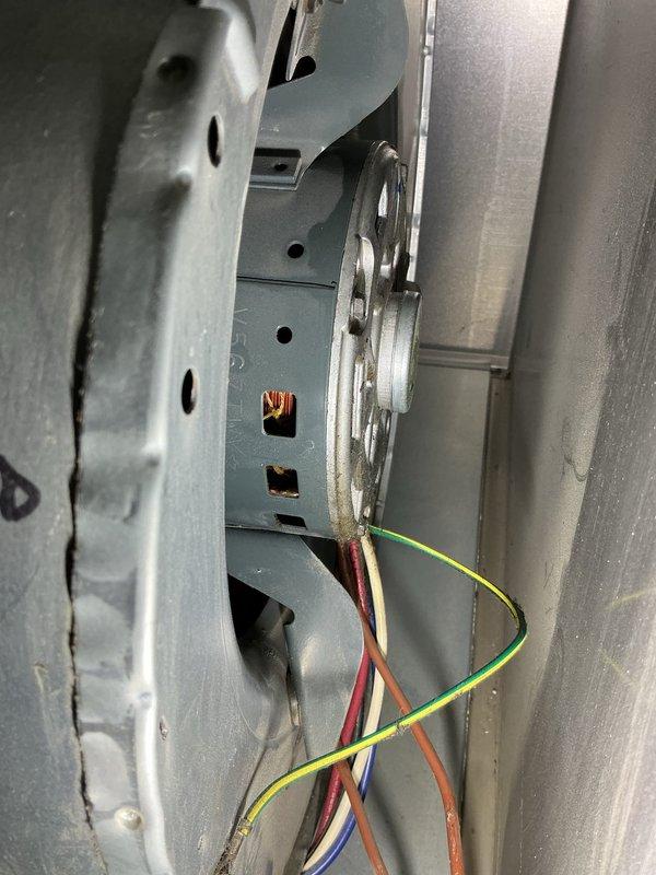 Completed annual cooling maintenance on residential split system. Inspected indoor blower motor assembly and electrical connections, verified proper operation of motor windings and drive components. Examined outdoor condenser unit, checked refrigerant line insulation and connections, confirmed fan operation and verified unit level on concrete pad. All components found in functional condition with normal wear patterns.