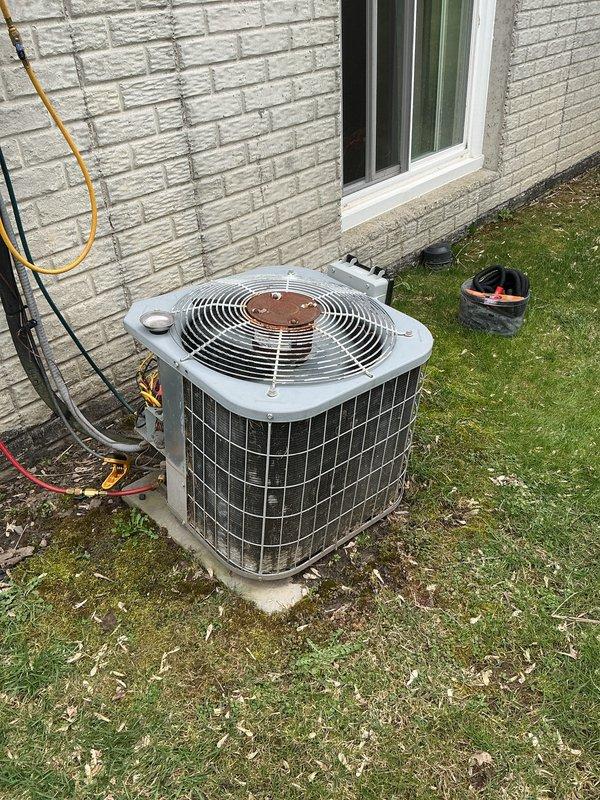 Completed annual cooling maintenance on residential split system. Inspected indoor blower motor assembly and electrical connections, verified proper operation of motor windings and drive components. Examined outdoor condenser unit, checked refrigerant line insulation and connections, confirmed fan operation and verified unit level on concrete pad. All components found in functional condition with normal wear patterns.