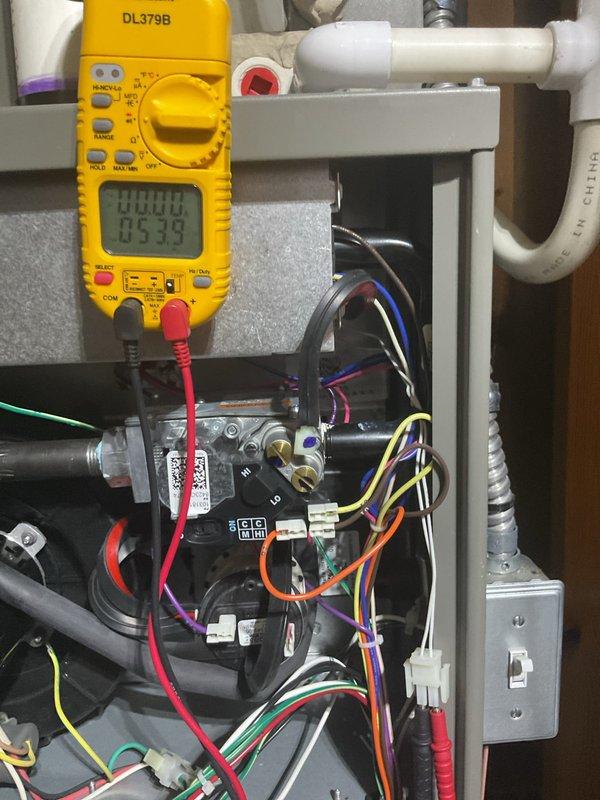 Completed annual heating maintenance on furnace system per membership agreement. Performed comprehensive tune-up including electrical diagnostics using digital clamp meter to verify amp draw and voltage readings at gas valve assembly and control board connections. All electrical measurements within manufacturer specifications. Inspected and tested all system components, wiring connections, and safety controls. System operating properly with no issues found.