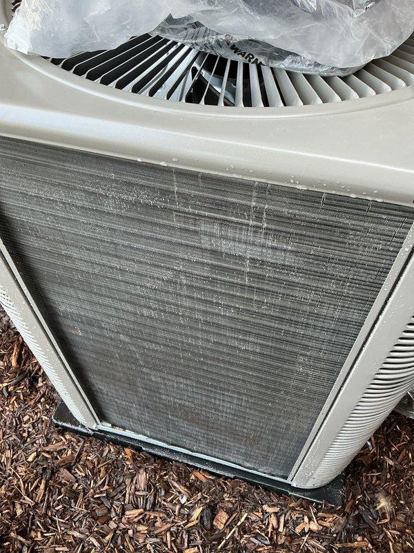 Completed routine Air Care Cooling maintenance on residential outdoor condensing unit. Performed visual inspection of condenser coil, noting light to moderate dust and debris accumulation on fin surfaces, which is typical for normal operation. Fan assembly and cabinet exterior found in acceptable working condition with no immediate service concerns identified.