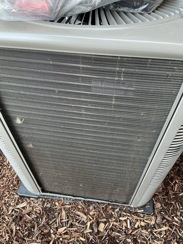 Completed routine Air Care Cooling maintenance on residential outdoor condensing unit. Performed visual inspection of condenser coil, noting light to moderate dust and debris accumulation on fin surfaces, which is typical for normal operation. Fan assembly and cabinet exterior found in acceptable working condition with no immediate service concerns identified.