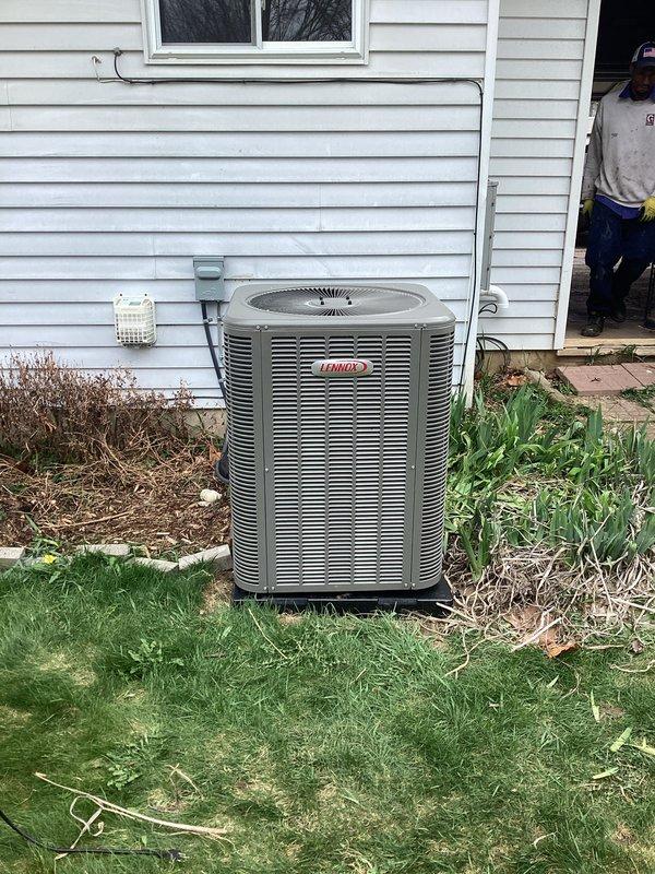 Completed return visit to finalize A/C installation following previous work. Ran 7/8" lineset with proper boots, installed new breaker, connected disconnect and whip, and ran low voltage wiring to complete A/C system connection. System tested and verified operational with Fieldpiece gauges confirming proper refrigerant pressures on newly installed Lennox condenser unit.