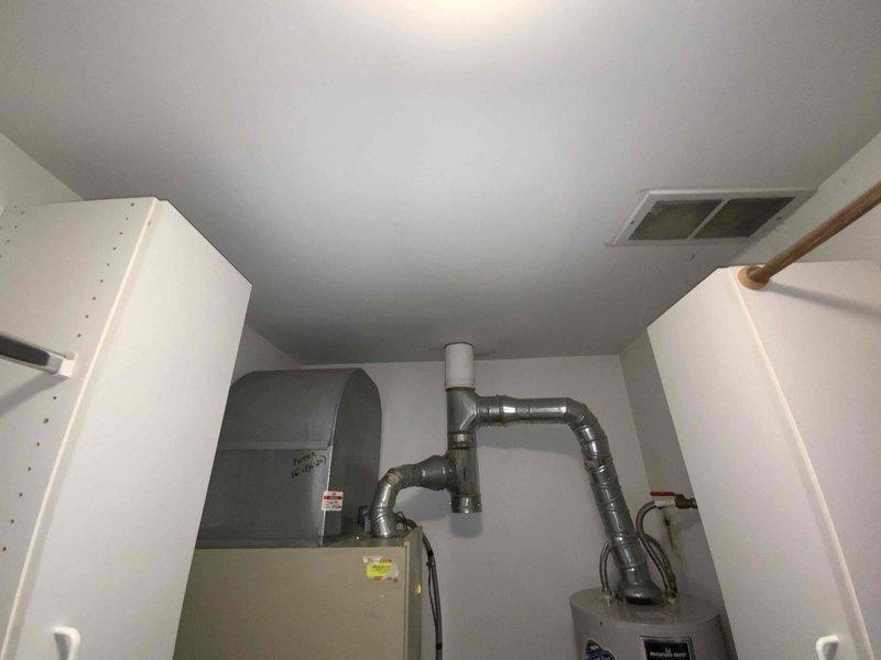 Conducted full system estimate for 1100 square foot condo with 16-year-old furnace and air conditioning system. Evaluated existing HVAC equipment located in mechanical closet, assessed ductwork configuration, and documented current system layout including water heater proximity and space constraints. Provided replacement options for complete heating and cooling system to address aging equipment ahead of upcoming season.