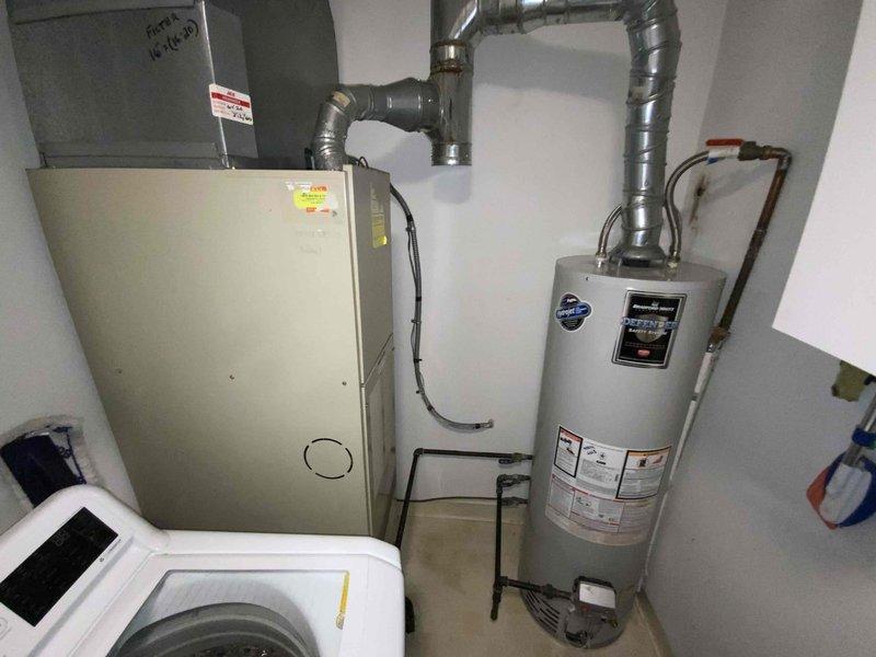 Conducted full system estimate for 1100 square foot condo with 16-year-old furnace and air conditioning system. Evaluated existing HVAC equipment located in mechanical closet, assessed ductwork configuration, and documented current system layout including water heater proximity and space constraints. Provided replacement options for complete heating and cooling system to address aging equipment ahead of upcoming season.