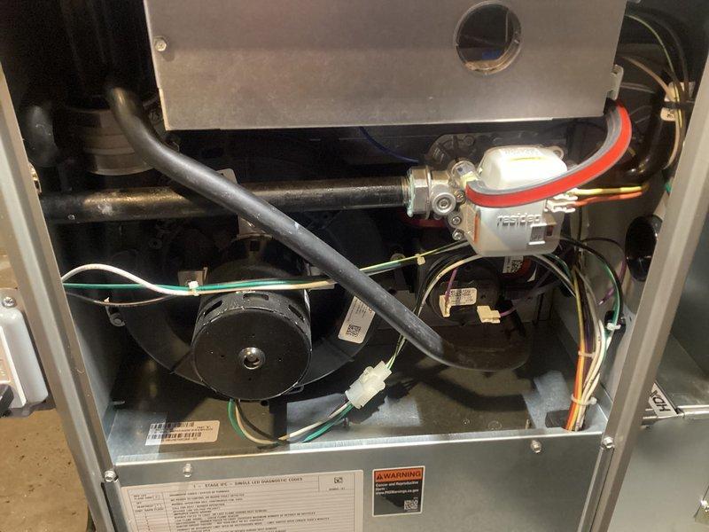 Completed annual furnace maintenance and tune-up on residential heating system. Performed comprehensive inspection of all internal components including blower motor assembly, heat exchanger, electrical connections, and safety controls. Verified proper operation of pressure switches, sensors, and condensate drainage system. All colored wiring connections inspected and confirmed secure. Blower motor and fan assembly checked for proper function. System tested and confirmed operating within manufacturer specifications with no issues identified.