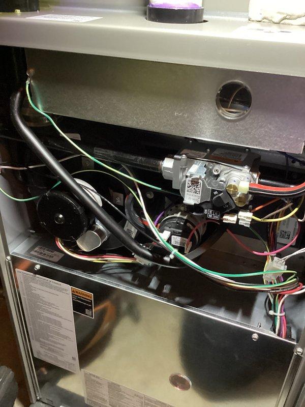 Completed scheduled Air Care Heating and Cooling maintenance on furnace unit. Replaced furnace filter and humidifier pad as requested. Performed comprehensive system inspection including gas valve assembly, blower motor, electrical connections, and all internal components. All wiring connections verified secure, system operational and functioning within normal parameters.