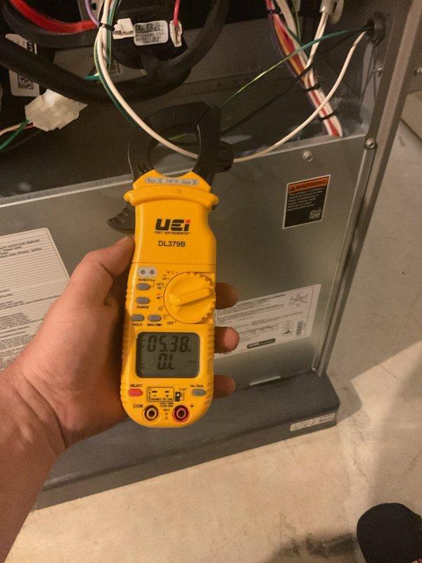 Completed annual furnace maintenance on gas-fired heating system. Performed comprehensive tune-up including inspection of blower motor, gas valve assembly, ignition components, and all safety controls. Verified proper electrical connections throughout both upper and lower compartments, tested system operation with digital multimeter confirming appropriate voltage readings at 53.8V, and inspected all wiring harnesses and control boards. Unit operating within normal parameters with no deficiencies noted. All components functioning properly upon completion of scheduled maintenance.