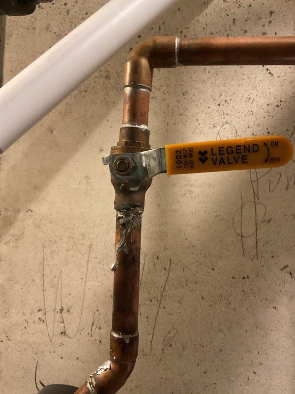 Responded to service call for overheating tanked water heater that required emergency shutdown by homeowner. Upon inspection of the one-year-old unit, diagnosed issue and installed new brass ball valve on copper supply line to improve system control and safety. Replaced corroded galvanized pipe section at pump discharge connection with new brass fitting to prevent future failures. System tested and returned to normal operation with proper temperature regulation restored.