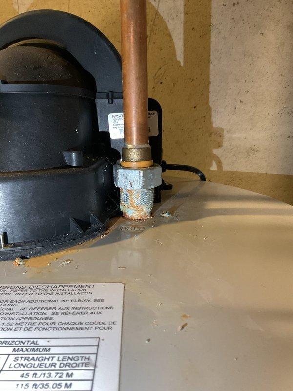 Responded to service call for overheating tanked water heater that required emergency shutdown by homeowner. Upon inspection of the one-year-old unit, diagnosed issue and installed new brass ball valve on copper supply line to improve system control and safety. Replaced corroded galvanized pipe section at pump discharge connection with new brass fitting to prevent future failures. System tested and returned to normal operation with proper temperature regulation restored.