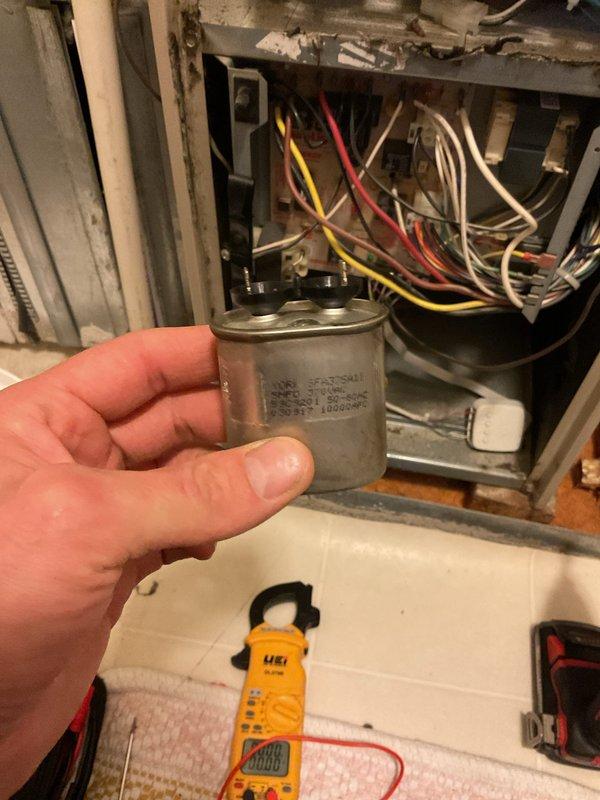 Responded to no-cooling call on 12-year-old central air conditioning system. Upon arrival, performed diagnostic testing and identified failed capacitor as root cause of system failure. Tested capacitor with multimeter, confirmed zero capacitance reading, and replaced defective component with properly rated unit. Verified all electrical connections, tested system operation, and restored cooling functionality to residential AC system.