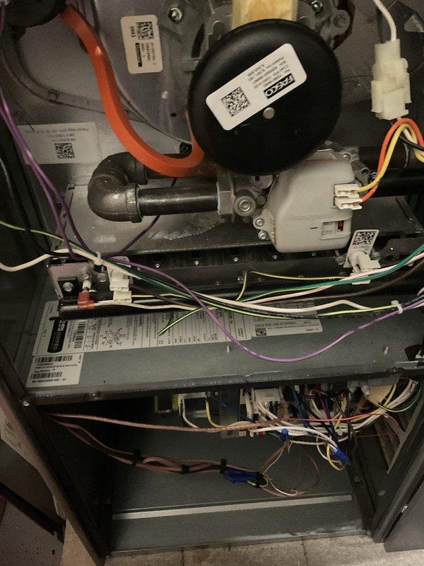 Completed annual HVAC maintenance (AHM) on air handling unit. Performed comprehensive system inspection, verified all electrical connections and components were functioning properly, and measured system voltage reading at 6.10V on motor assembly. Documented internal unit condition with photos showing blower motor, control board wiring, and electrical components in good operating condition.