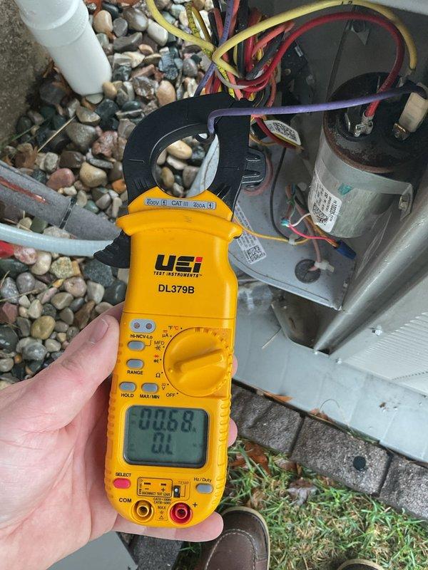 Completed scheduled air conditioning maintenance on residential condensing unit. Performed electrical diagnostics using clamp meter to verify proper amperage draw on compressor and fan motor circuits. Installed PCO kit and replaced evaporator pad as part of routine maintenance protocol to ensure optimal system performance and air quality.