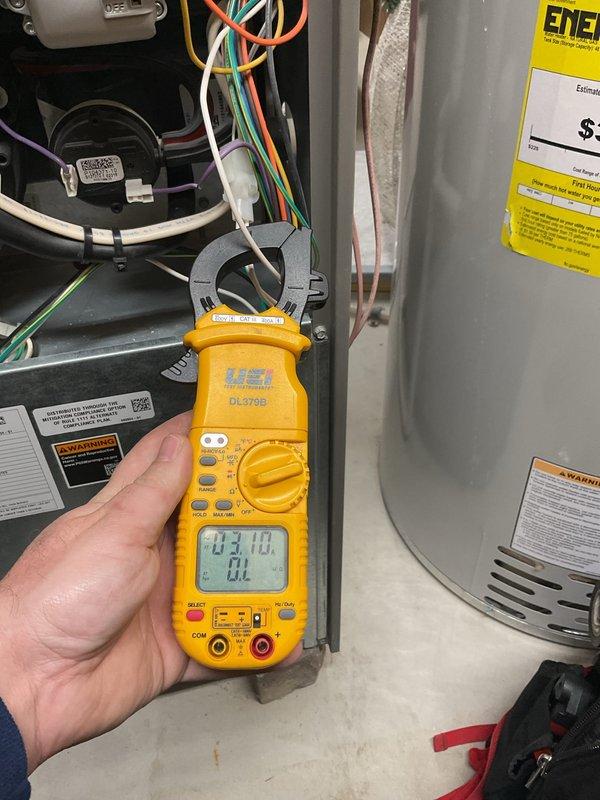Completed scheduled air conditioning maintenance on residential condensing unit. Performed electrical diagnostics using clamp meter to verify proper amperage draw on compressor and fan motor circuits. Installed PCO kit and replaced evaporator pad as part of routine maintenance protocol to ensure optimal system performance and air quality.