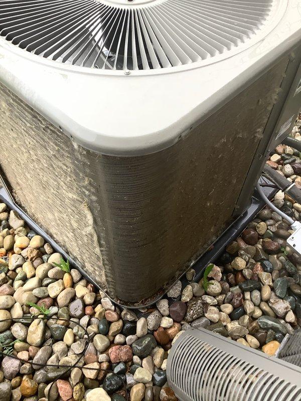 Performed annual cooling maintenance on outdoor condensing unit. Upon arrival, found condenser coils heavily contaminated with dirt, dust, and environmental debris causing significant airflow restriction. Cleaned and straightened condenser fins, removed accumulated grime from exterior panels, and verified proper unit operation. System tested and confirmed operating within normal parameters following maintenance completion.