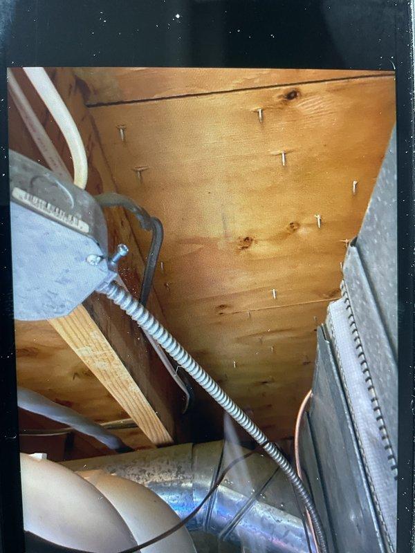 Responded to installation callback to address electrical code violation on 4-month-old furnace system located in basement. Corrected MC cable securing issue by installing proper fasteners within 12 inches of junction box as required by code. Verified furnace operation, confirmed heating functionality, and ensured all electrical connections meet current code compliance standards.