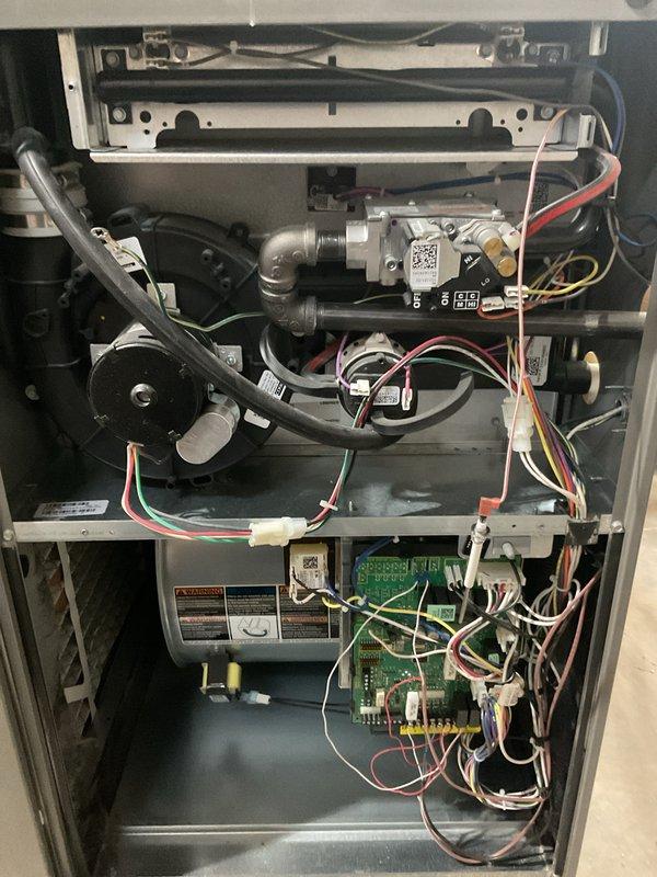 # HVAC Maintenance Service Completed

Performed comprehensive ComfortGuard maintenance package on residential heating and cooling system. Conducted thorough inspection of gas furnace internal components, including gas valve assembly, blower motor, electrical connections, and control board. Verified all wire connections were secure and properly routed throughout the cabinet. Examined ignition system and safety controls for proper operation.

Replaced furnace air filter as specified in maintenance package. Installed new humidifier pad to ensure optimal humidity control and system performance during heating season. Inspected humidifier water supply and drainage for proper function.

Proceeded to outdoor condensing unit and performed exterior equipment inspection. Examined condenser housing, fan assembly, and electrical disconnect box. Verified unit was level on mounting pad and all external connections were secure. Checked refrigerant line insulation and condensate drainage system includi