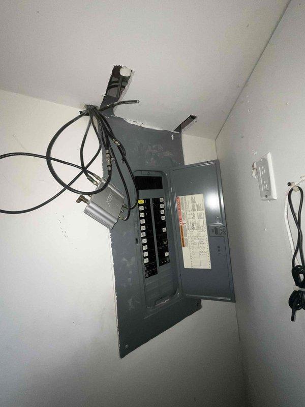 Conducted on-site assessment for whole home generator installation at a 1990s-era residence. Evaluated existing electrical infrastructure, including main service panel location in basement utility area. Documented current electrical panel configuration with dual rows of circuit breakers and incoming service conductors. Assessed available space and utility access points for generator placement and necessary electrical connections. Photographed electrical panel and utility room conditions to determine load requirements and transfer switch installation location. Provided comprehensive estimate for complete generator system installation including equipment options, transfer switch, gas line connection requirements, and electrical integration with existing service panel.