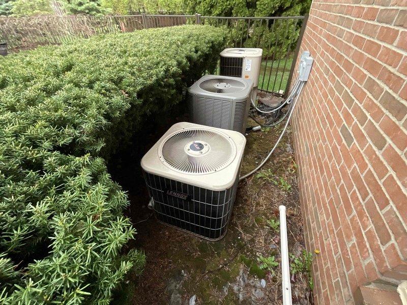 Conducted site evaluation for air conditioning replacement at residential property with non-operational A/C unit located in basement. Assessed existing HVAC infrastructure including ductwork, electrical panels, and outdoor condensing unit configuration with multiple units positioned on concrete pad against exterior brick wall. Provided comprehensive estimate for A/C system replacement to restore cooling capacity to home.