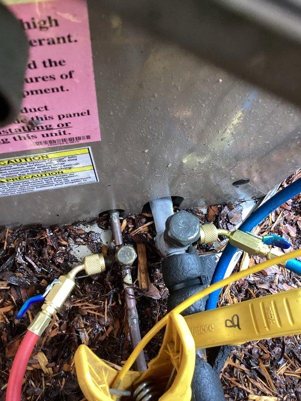 Responded to no cooling call with outdoor unit iced up. Upon arrival, found evaporator coil frozen with significant ice buildup on refrigerant lines and exterior components. Used digital thermometer to verify temperature differentials across system components. Inspected electrical connections at condensing unit, noting all wire terminations secure with proper insulation caps. Documented coil condition and wiring configuration. System requires thawing before further diagnostics can be performed to determine root cause of freezing condition, which may include low refrigerant charge, restricted airflow, or failed blower motor. Recommended follow-up service after ice melts to complete refrigerant pressure testing and airflow measurements.