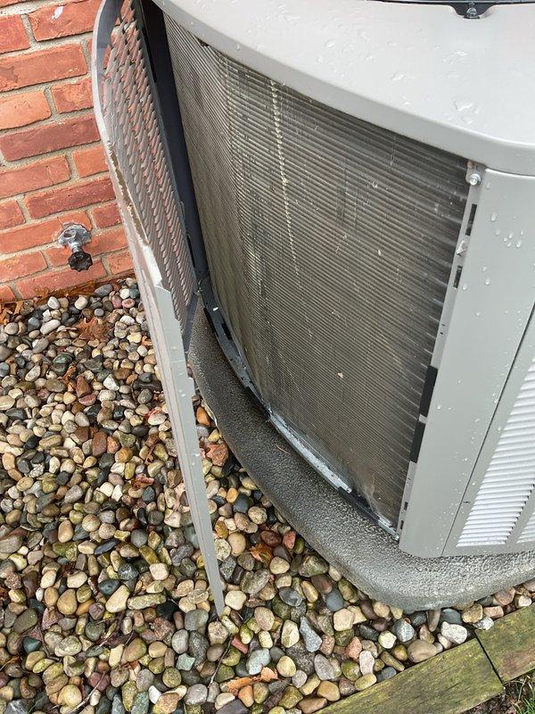 Completed annual air conditioning maintenance on residential split system. Customer clarified system configuration includes boiler for heating with separate air handler and outdoor condensing unit for cooling purposes. Performed comprehensive inspection of outdoor unit, verified proper placement on gravel pad with adequate clearance, and confirmed structural integrity of cabinet and protective grilles. Documented equipment condition showing normal weathering consistent with outdoor exposure. System operational and ready for cooling season.