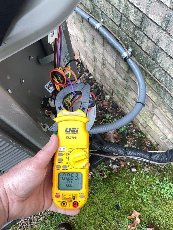 # HVAC Maintenance - ACM Completed

Performed routine Air Care Maintenance on residential air conditioning system. Conducted electrical diagnostics at outdoor unit disconnect box using digital multimeter to verify proper voltage and amperage readings. All electrical connections tested and confirmed within normal operating parameters, ensuring safe and efficient system operation.