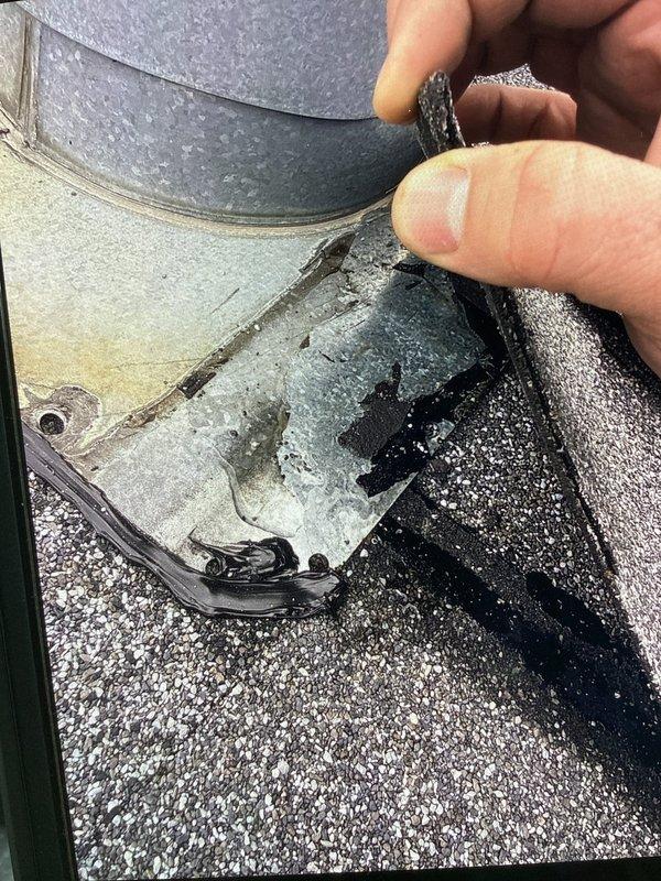 Responded to call for water leaking from venting onto 3-year-old furnace in mobile home. Upon inspection, discovered severely corroded roof vent termination cap with heavy rust deterioration allowing water infiltration through the flue system. Documented contamination and water damage on furnace cabinet and surrounding components caused by compromised vent assembly. Advised replacement of corroded vent cap and inspection of flue pipe integrity to prevent further water intrusion and potential safety hazards.