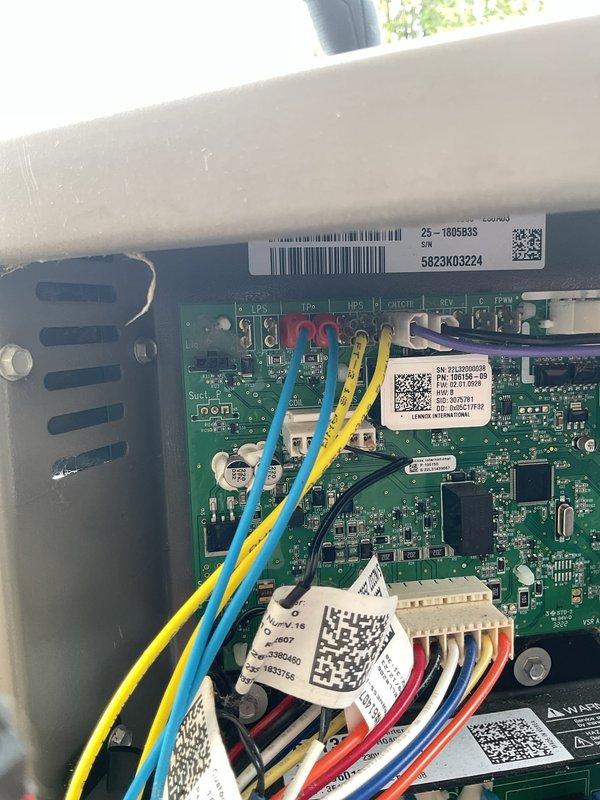 Responded to service call for 2-year-old A/C unit not coming on with furnace located in basement and condensing unit outside. Diagnosed control board issue and performed necessary repairs to restore system operation. Documented control board wiring connections and exterior equipment installation, with work completed under parts and labor warranty coverage.