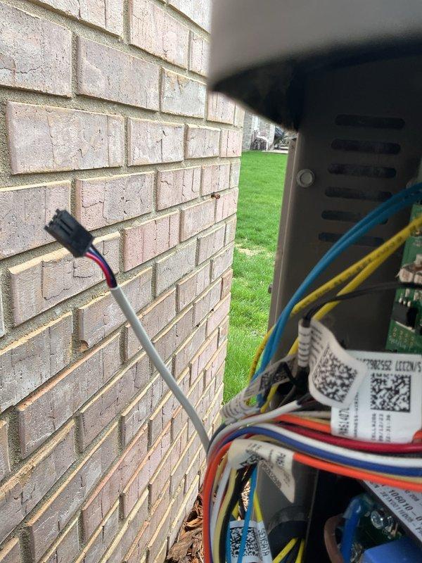 Responded to service call for 2-year-old A/C unit not coming on with furnace located in basement and condensing unit outside. Diagnosed control board issue and performed necessary repairs to restore system operation. Documented control board wiring connections and exterior equipment installation, with work completed under parts and labor warranty coverage.