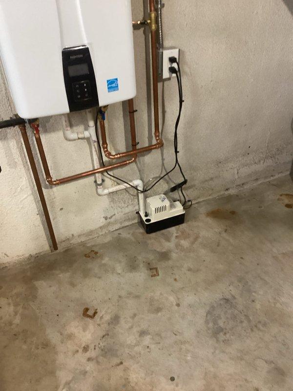 Completed full HVAC system installation including new air conditioning unit and evaporator coil in basement mechanical room. Connected refrigerant lines to existing furnace plenum, installed flexible aluminum ductwork, and integrated all electrical and condensate drainage components. System tested and verified operational with all connections secured and permits obtained per code requirements.