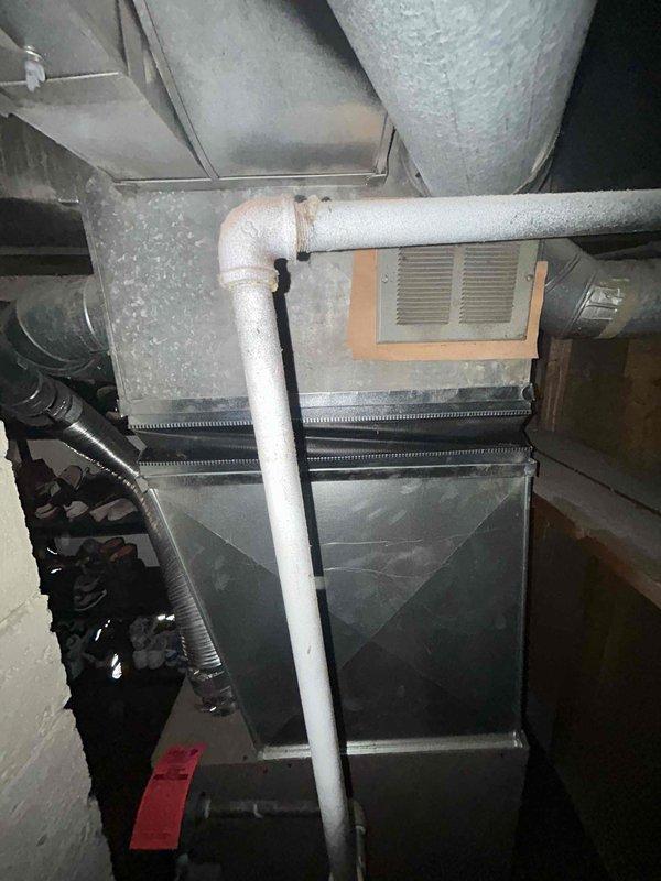 Conducted on-site evaluation for new air conditioning system installation at residential property currently without existing AC equipment. Assessed basement mechanical room containing furnace/air handler unit with existing ductwork infrastructure, including flexible and insulated ducting with metal plenum connections. Evaluated utility area layout, existing HVAC components, and available space for proposed AC condenser and associated refrigerant line routing to determine optimal system configuration and installation requirements for complete estimate preparation.