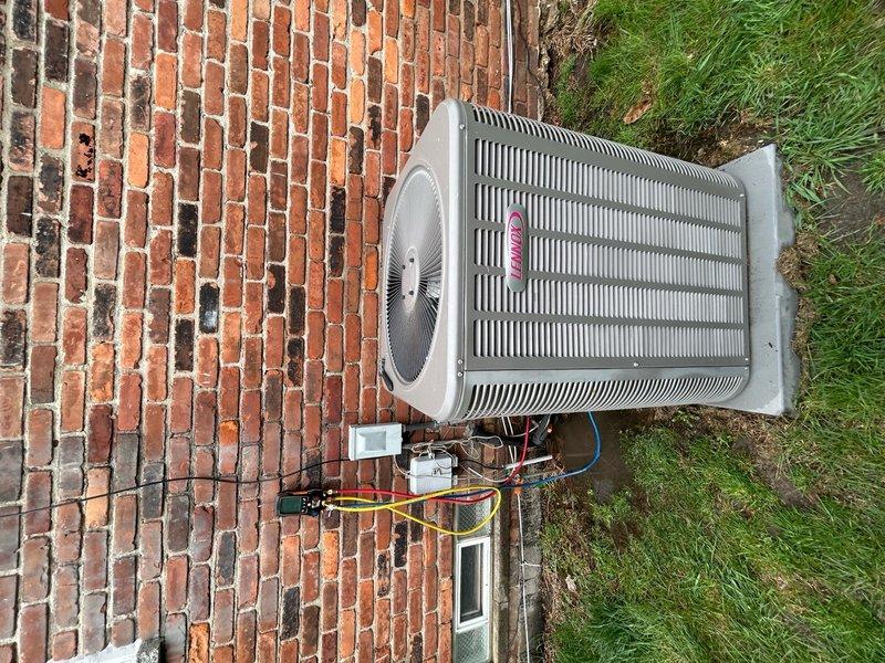 Responded to callback for 10-year-old Lennox air conditioning system experiencing water leakage into basement, failure to start, and previous evaporator coil icing. Upon inspection, verified outdoor condenser unit operational with proper refrigerant line connections and electrical supply intact. Examined basement-located indoor air handler and evaporator coil assembly, identifying condensate drainage issue as primary cause of water intrusion. Cleared blocked condensate drain line, verified proper drainage flow, and confirmed evaporator coil no longer freezing due to restored airflow and drainage. Checked refrigerant pressures, amperage draw, and thermostat operation to ensure system cycling correctly. System restored to normal cooling operation with no active leaks or icing present at time of service completion.