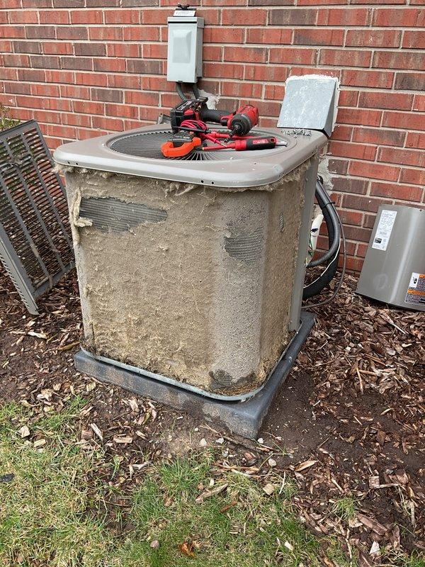 Completed annual cooling maintenance on residential split system air conditioning unit. Performed comprehensive inspection of outdoor condenser unit, which exhibited heavy accumulation of dirt, dust, and debris on exterior cabinet surfaces. Cleaned condenser coils, checked refrigerant lines, verified electrical connections at disconnect box, and tested system operation to ensure proper cooling performance for upcoming season.
