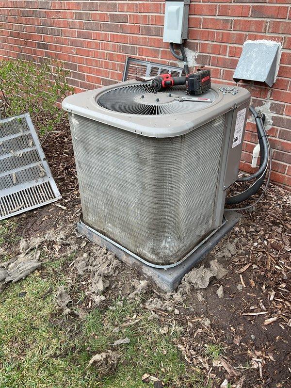 Completed annual cooling maintenance on residential split system air conditioning unit. Performed comprehensive inspection of outdoor condenser unit, which exhibited heavy accumulation of dirt, dust, and debris on exterior cabinet surfaces. Cleaned condenser coils, checked refrigerant lines, verified electrical connections at disconnect box, and tested system operation to ensure proper cooling performance for upcoming season.