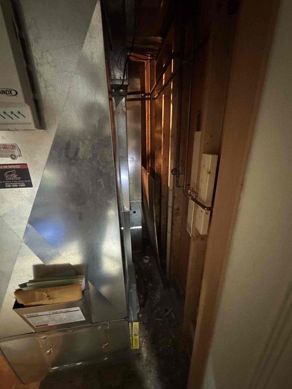 Provided estimate for complete air conditioning system replacement including outdoor condensing unit and indoor air handler/furnace. Existing 2007 system is non-operational and requires full replacement with new equipment, refrigerant lines, and associated components for basement-located indoor unit and exterior condensing unit installation.